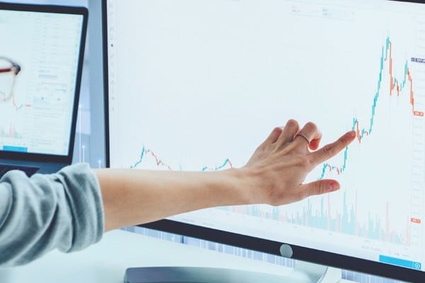 A woman looking into graph report
