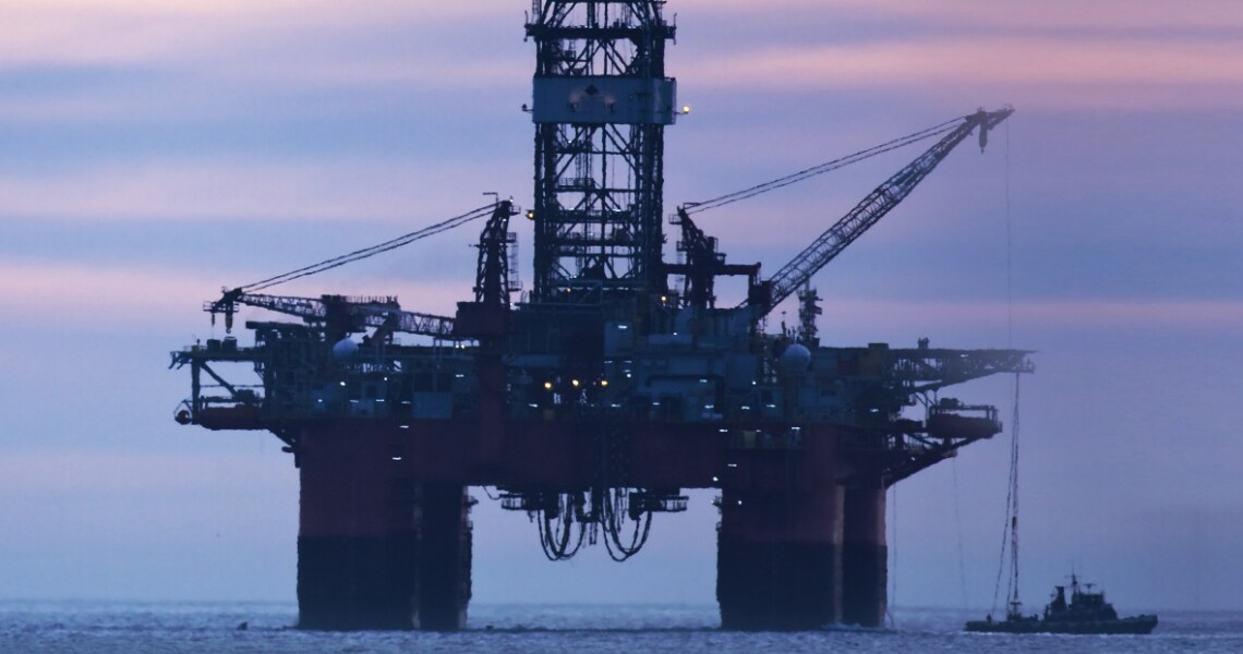 An oil rig during dusk