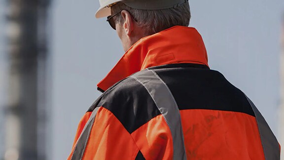 man-in-orange-jacket