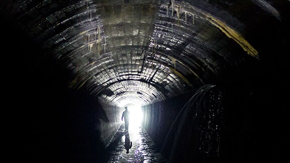 Safety officer monitoring the atmosphere in a confined space