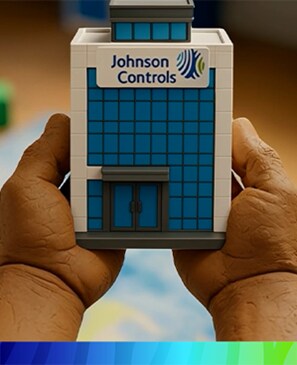 Person holding the JCI building toy in his hands