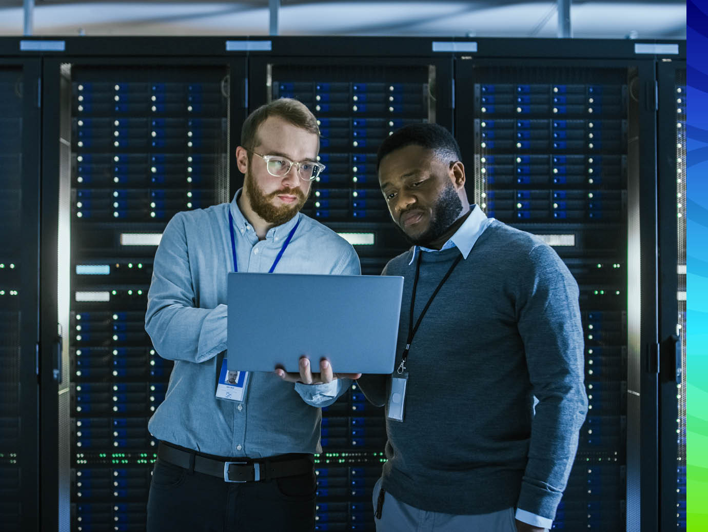Employees looking into laptop