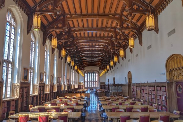 Interior view of library with tables and chairs 