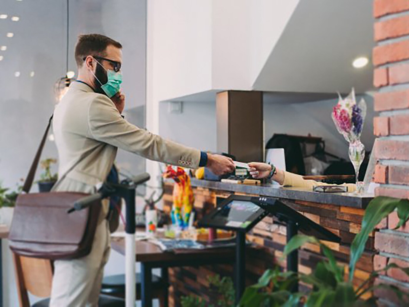 A man buying the items by using the credit card