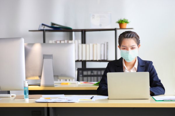 Women working on the laptop in office room