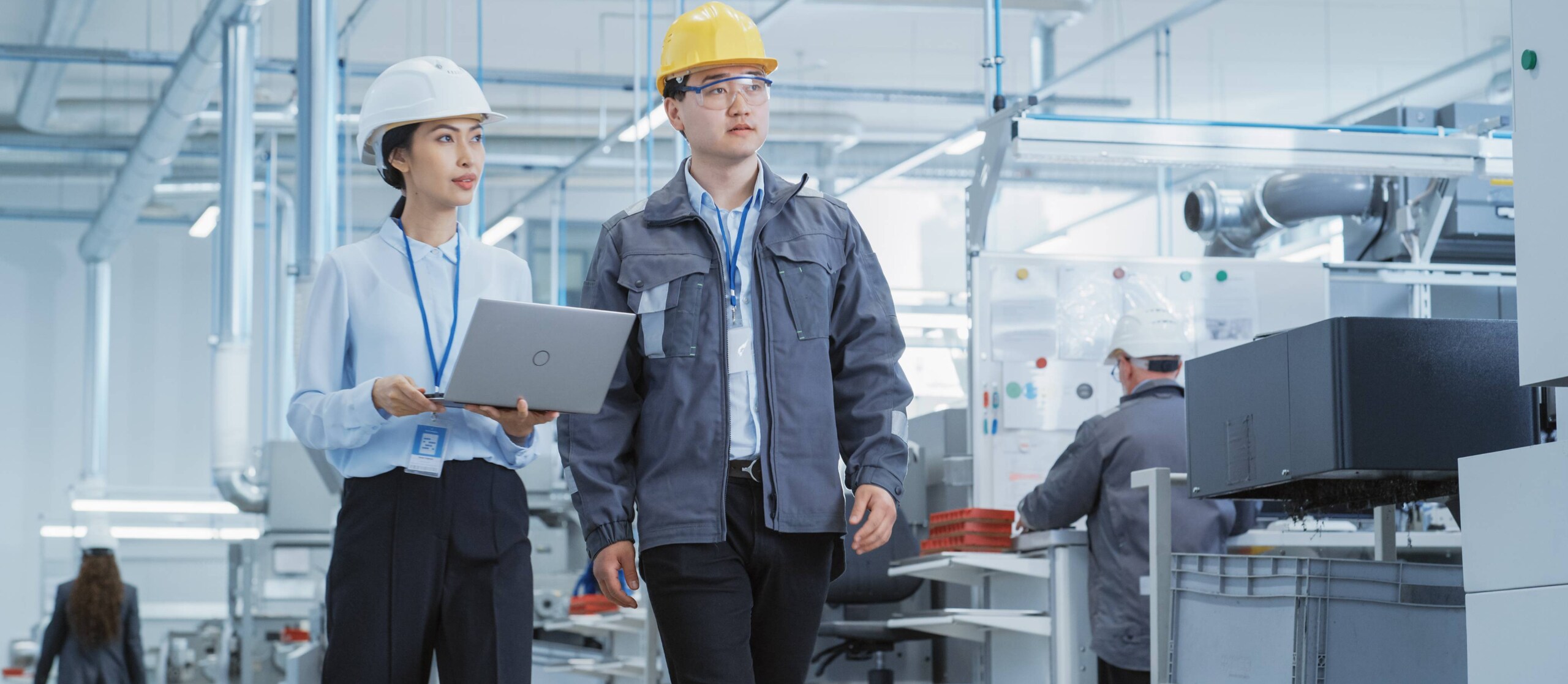 Two people looking at system