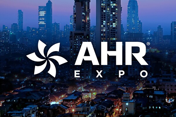 Night view of modern buildings with AHR Expo text written