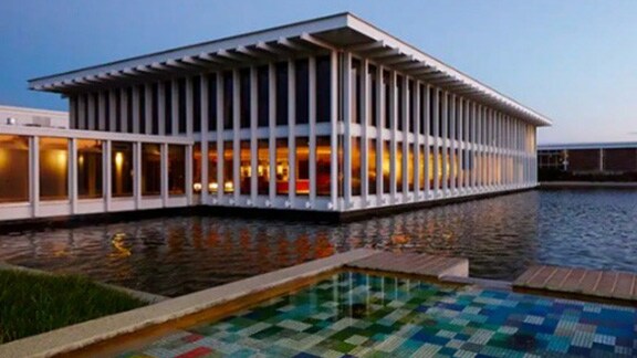 View of a modern building across a water body
