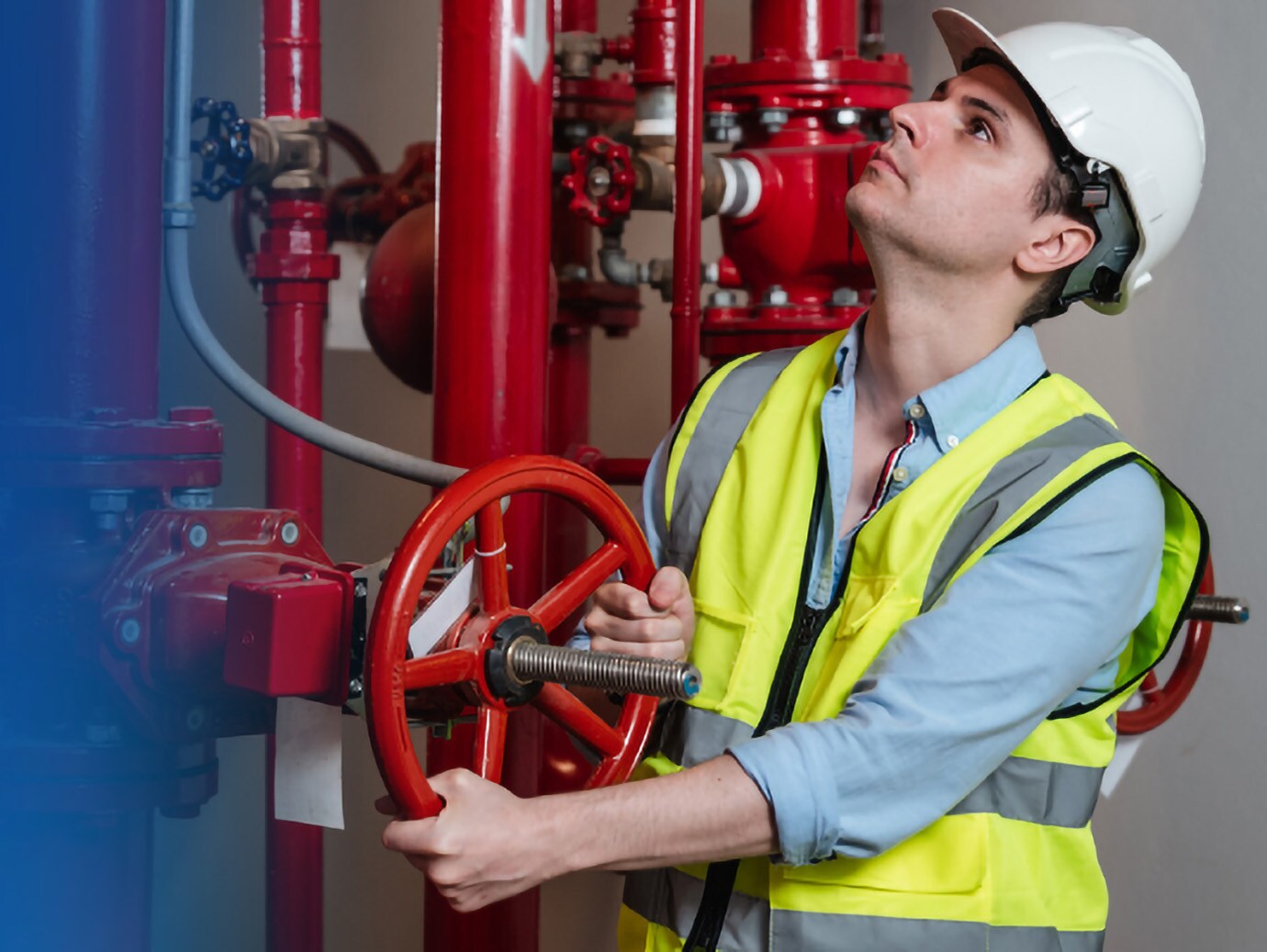 Maintenance worker operating a piping system