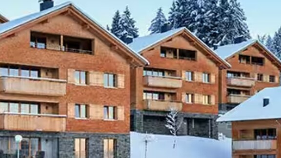 Red-brick houses in a neighbourhood on a snowy day