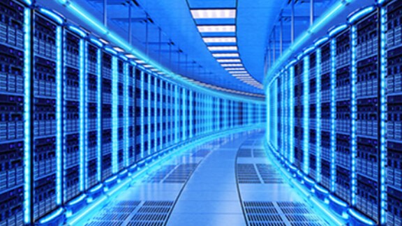 Hallway in a server room with racks on either side