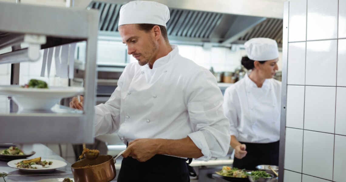 Chefs at work in the kitchen of a restaurant