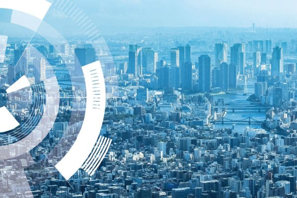 Ariel view of a city with a blue undertone and circular graphics