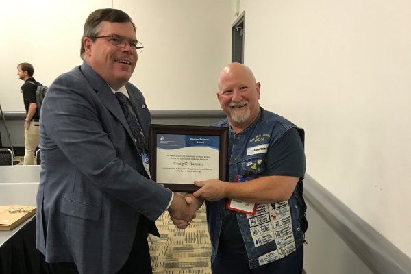 Craig Hannah of Johnson Controls receiving the George Anderson Award from AWWA Metering Standards Committee during the 2019 AWWA Annual Conference and Exposition
