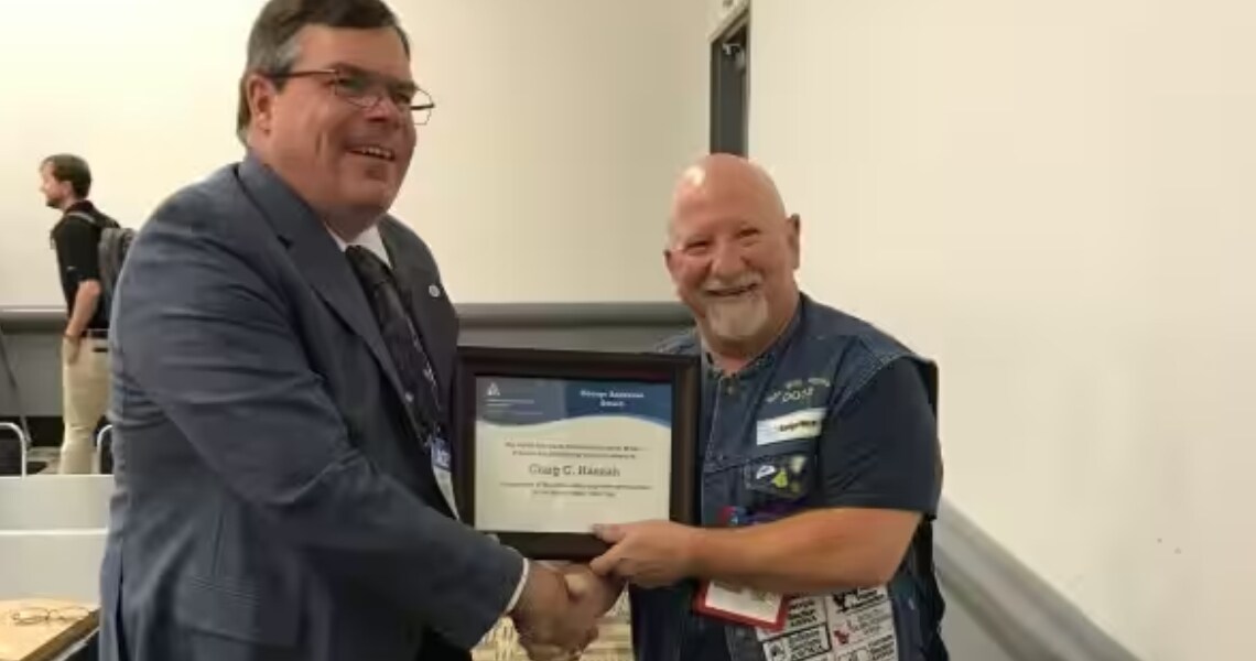 Craig Hannah of Johnson Controls receiving the George Anderson Award from AWWA Metering Standards Committee during the 2019 AWWA Annual Conference and Exposition