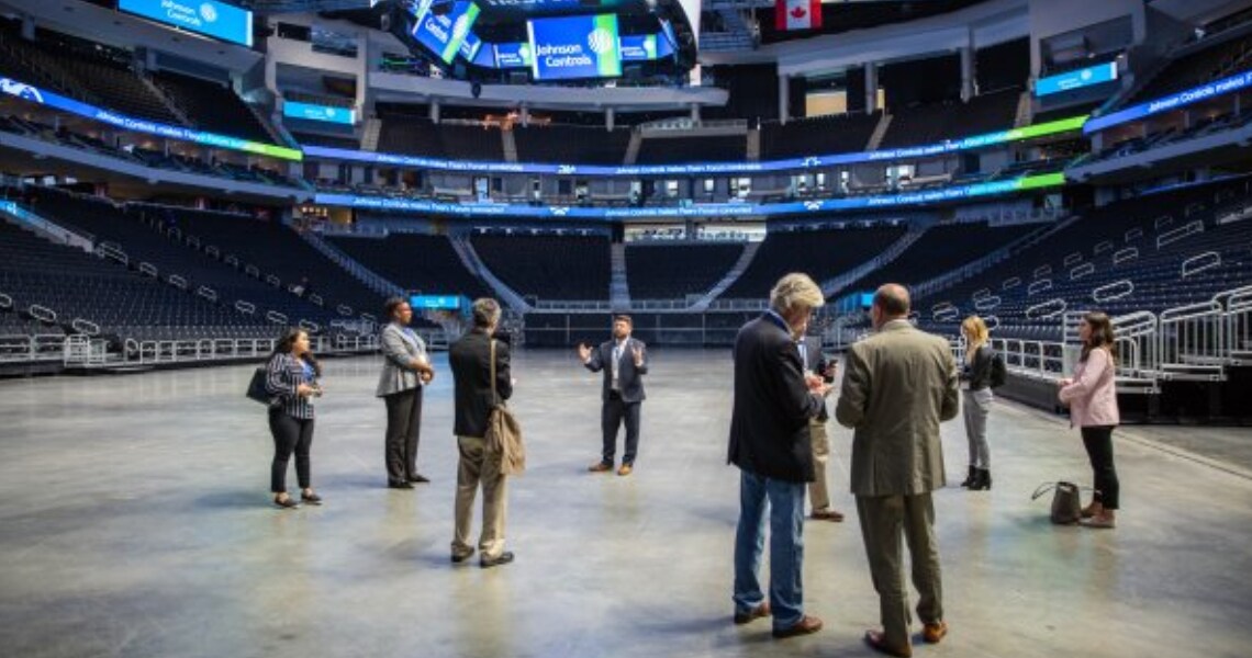 People looking around in the Fiserv Stadium