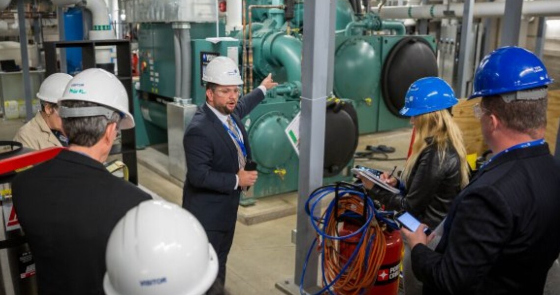 Nick Treder presenting York HVAC equipment to a crowd at Fiserv Forum stadium.