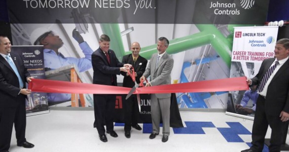 Al Young, Kevin Clark and Scott Shaw cut a ribbon to unveil the new Johnson Controls-sponsored classroom at Lincoln Tech’s East Windsor campus
