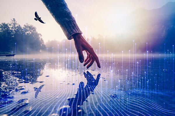 A human hand touching the surface of a water body, overlaid with a graphic of transmission nodes