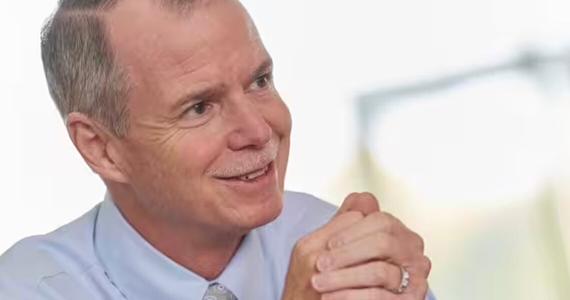 Johnson Controls Chairman and CEO George Oliver smiling during an interview