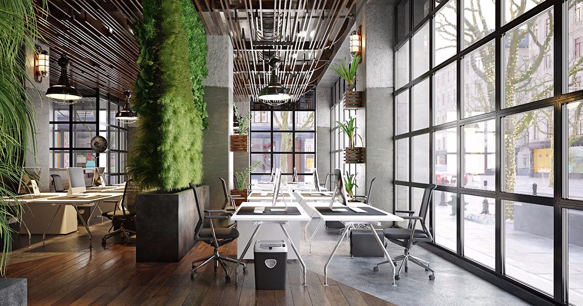 Interior of an empty office space, amply decorated with plants