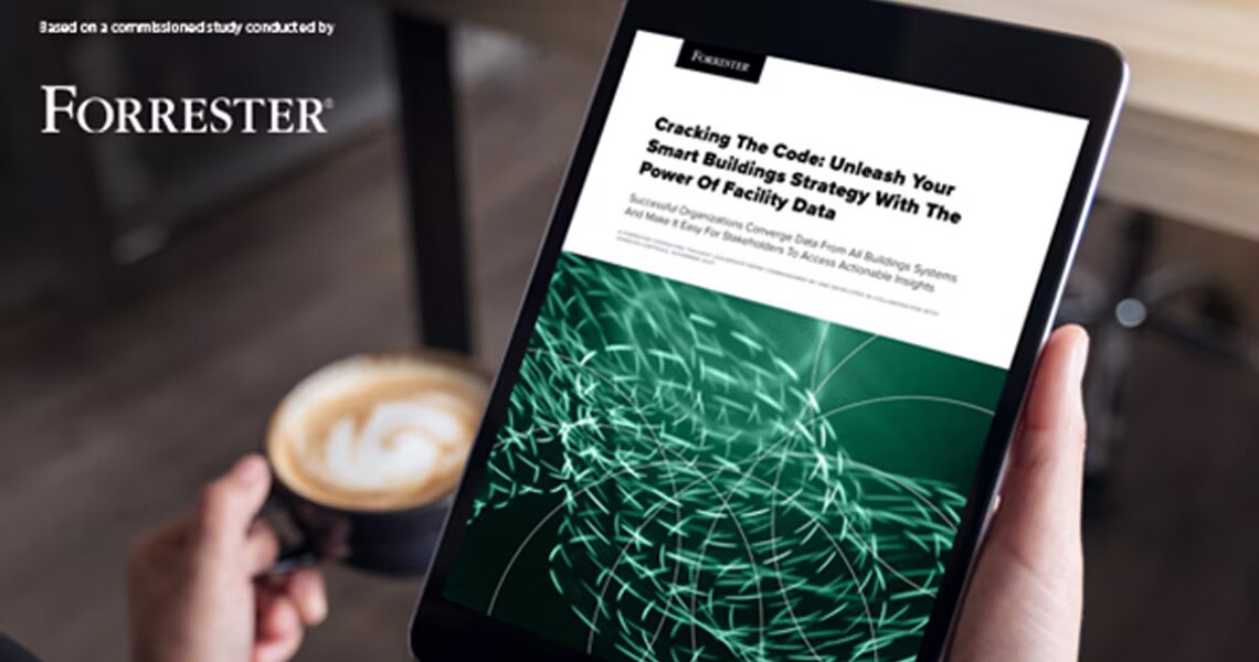 A person holding a tablet displaying a commissioned study by Forrester