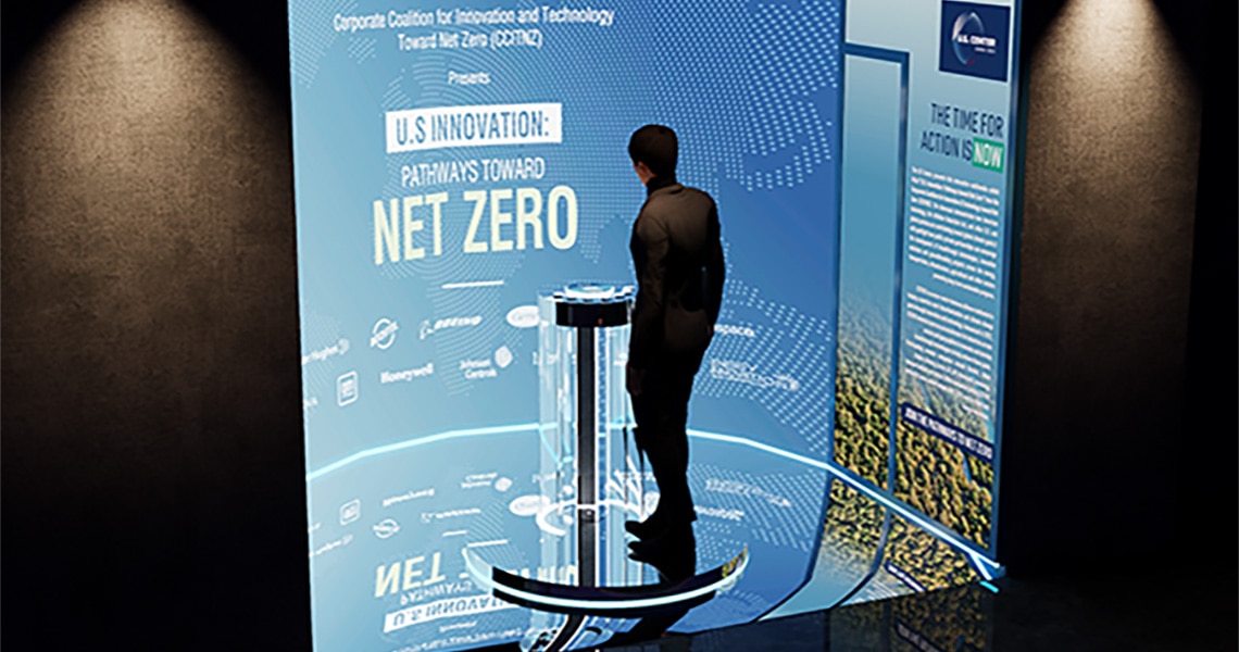 Man standing at the podium of the American Innovation Showcase at U.S. Center at COP29