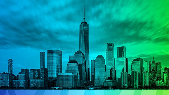 Skyline of a city during sunset with a green and blue overlay