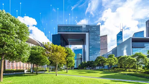 Corporate buildings behind a lawn with trees