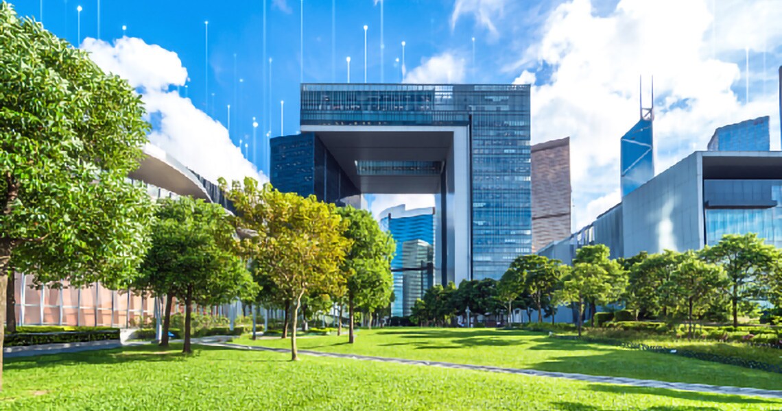 Corporate buildings behind a lawn with trees