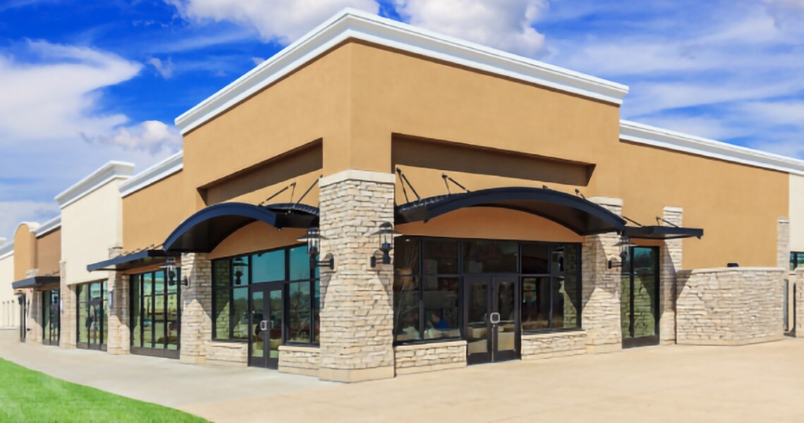 A shop building against a clear blue sky