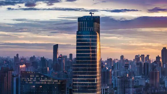Highrise buildings against the evening sky