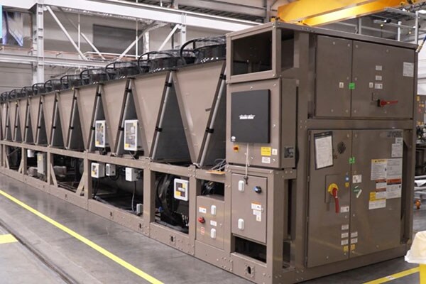 The York YVAM air-cooled magnetic bearing centrifugal chiller is designed for hyperscale and colocation data center cooling and operates with the ultra-low GWP refrigerant R-1234ze. It features industry-leading efficiency, simplified design, and low harmonics. Designed specifically for data centers, it achieves the same cooling while cutting the energy required by 78% as compared to conventional HVAC.