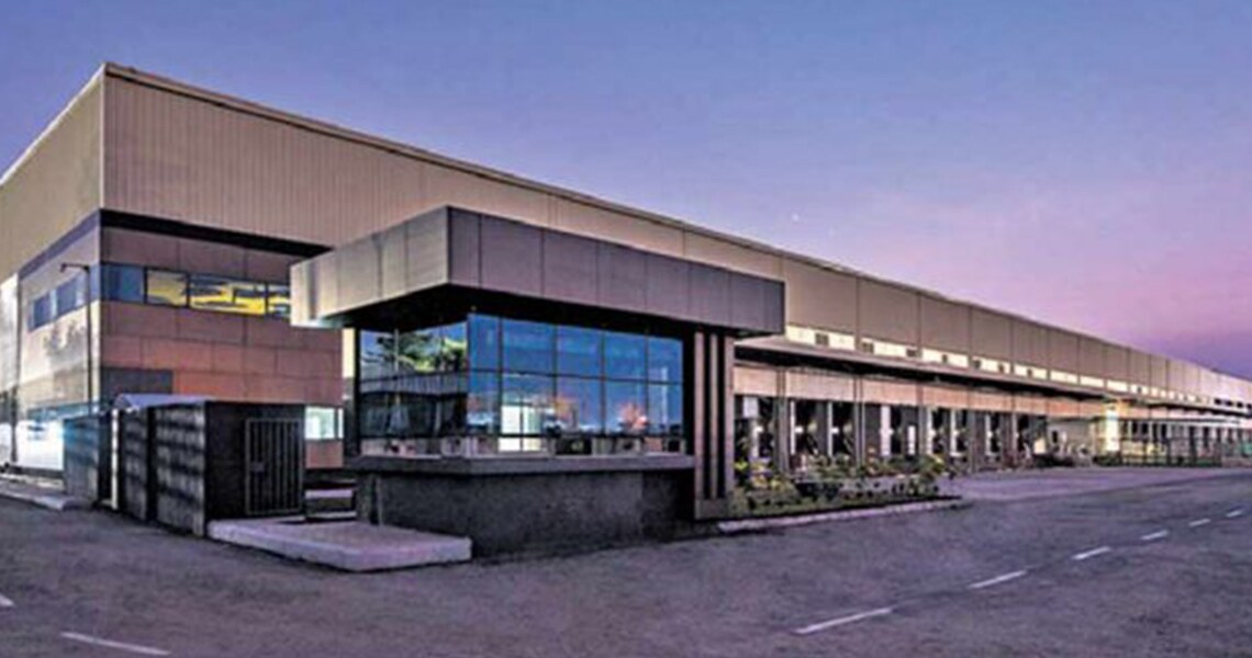 The ESR Industrial and Logistics Park building lit up at dusk