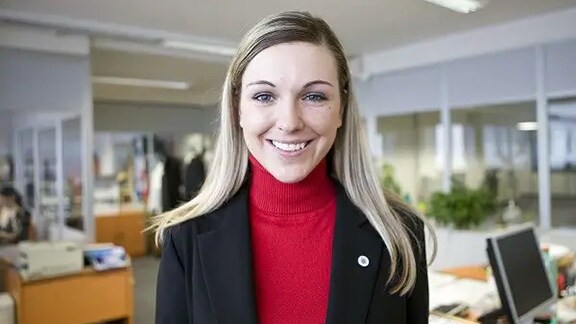 A woman smiling in an office
