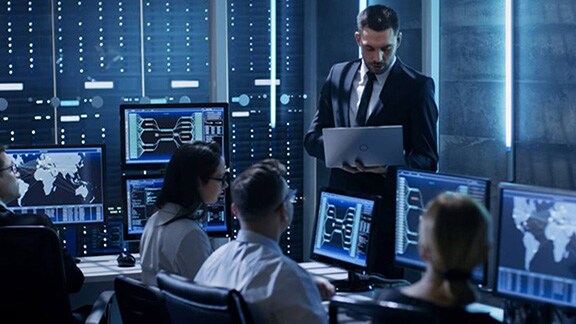 Group of data scientists working on codes in an office room