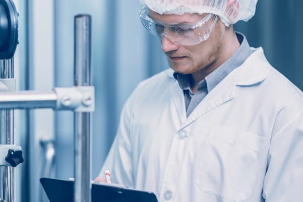 A technician looking into report