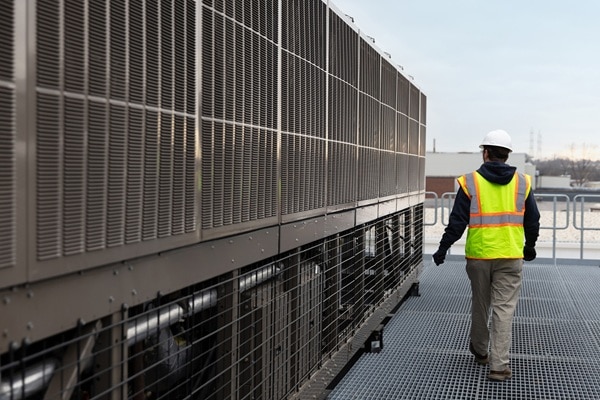 Person walking besing HVAC equipment