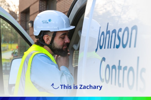 Technician standing near JCI van