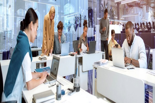 People looking into laptop while working