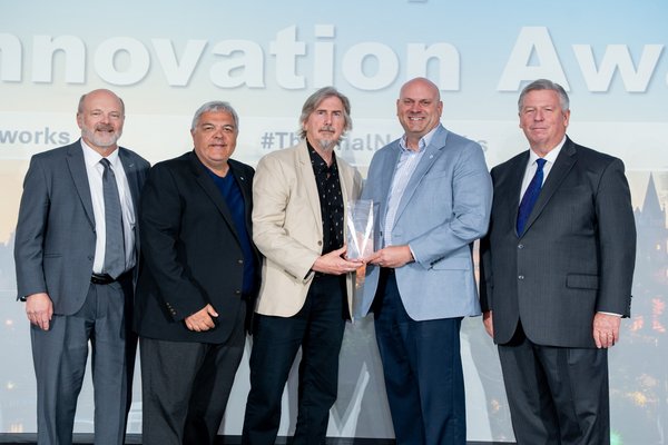 IDEA Innovation Award Committee Chair Bob Smith (on far left) and IDEA President & CEO, Rob Thornton (on far right) present JCI and University of Windsor with the 2026 IDEA Joseph M. Brillhart Innovation Award. Also pictured from left to right: Glenn Gault, JCI, John Regier, University of Windsor, and James Rosner, Johnson Controls