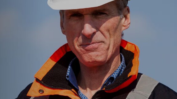 Maintenance worker looking toward the camera