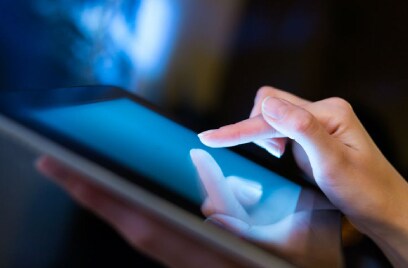 closeup of a woman scrolling on a screen-tablet