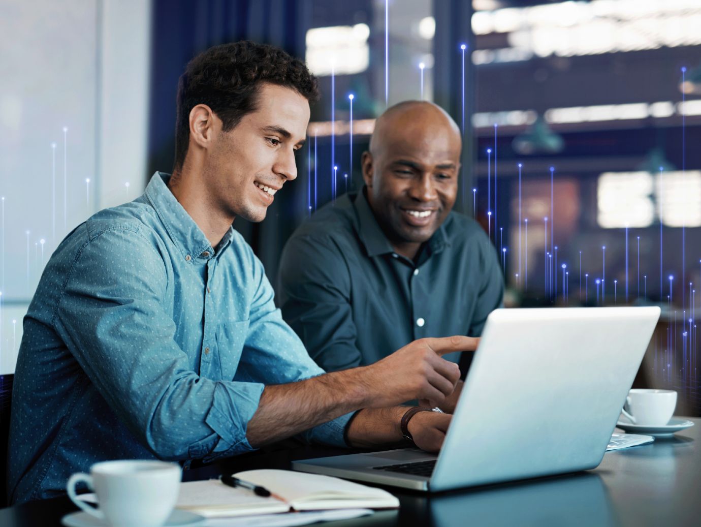 Two male employee discussing something on the laptop