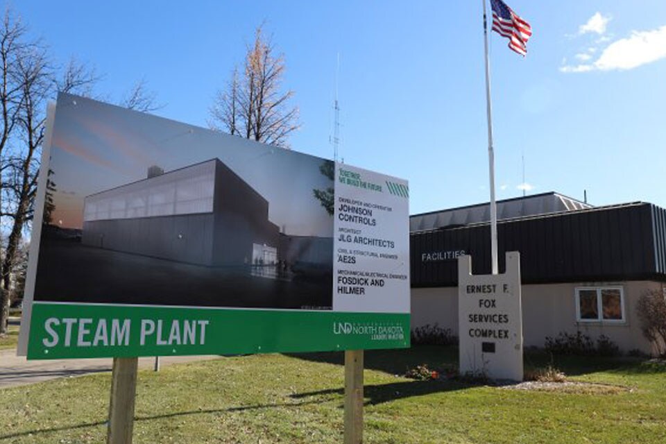 A board with information about a steam farm on the University of North Dakota campus