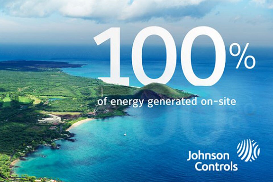 Johnson Controls banner for "100% of energy generated on-site" overlaid on a scenic landscape