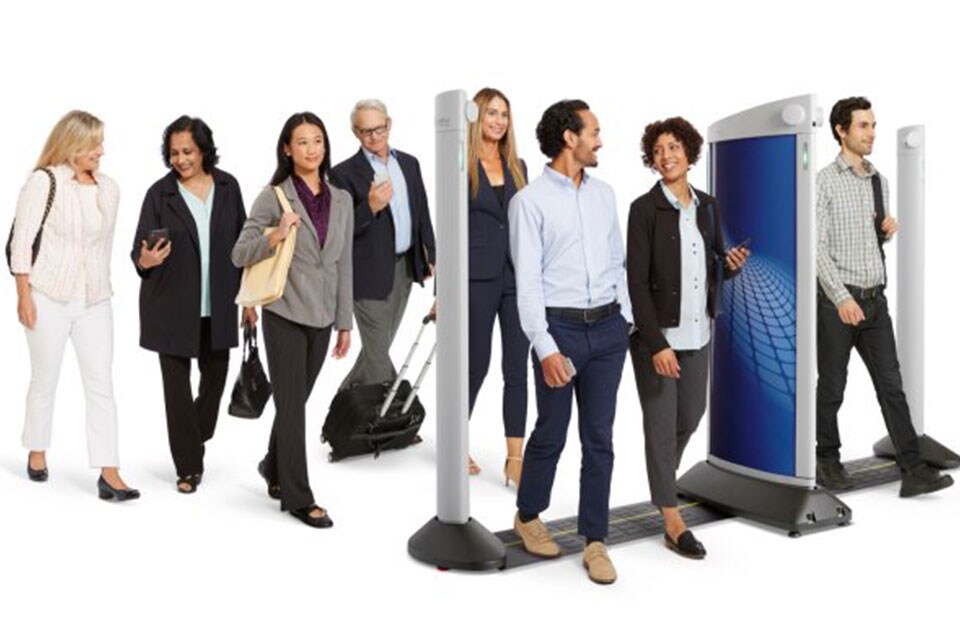 People walking through a metal detector
