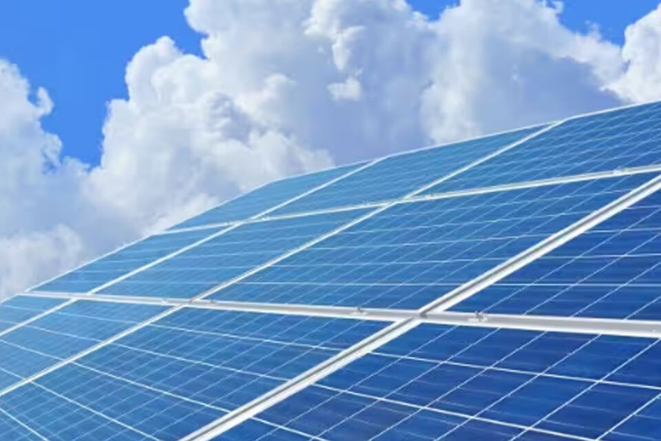 A series of solar panels against a clear sky