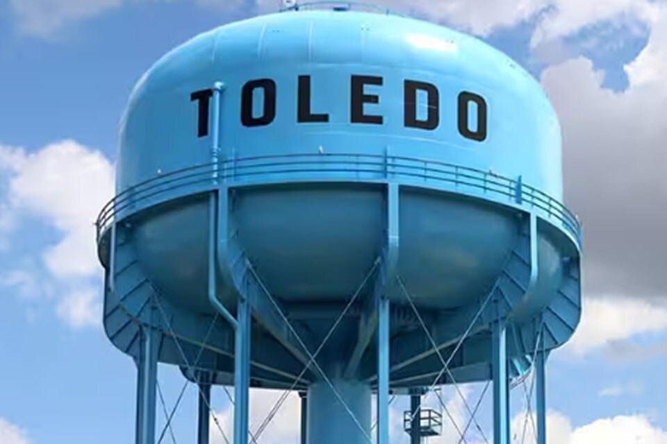 Blue water tank with 'Toledo' written on it