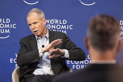 George Oliver, CEO of Johnson Controls, seated at a World Economic Forum meet